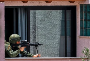 Israeli military personnel operating near the Lebanon border following renewed clashes with Hezbollah.