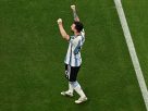 Argentina head coach Lionel Scaloni speaking with captain Lionel Messi during a FIFA World Cup match