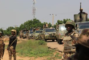 Security personnel near a secondary school in Borno State following an attack during a NECO examination